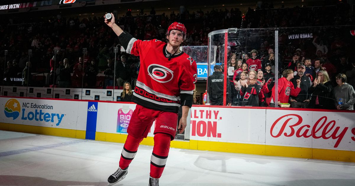 Featured image for Injured Hurricanes star cheers on team amidst playoff controversy.