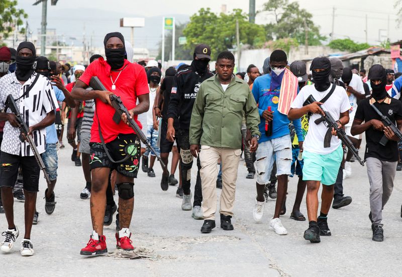 "Haitian Gangs Demand PM Henry's Overthrow Amid Escalating Chaos"