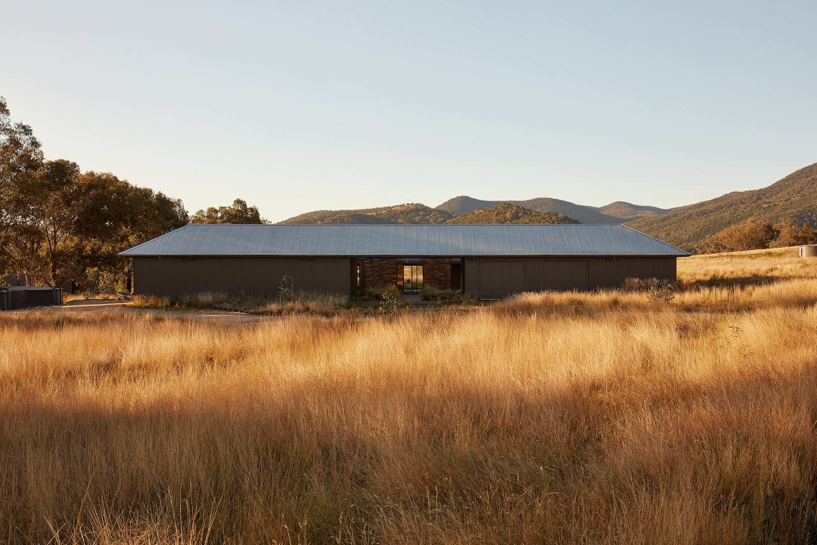 Featured image for Rural Australian Compound Gets Tied Together with Corrugated Metal Roof.
