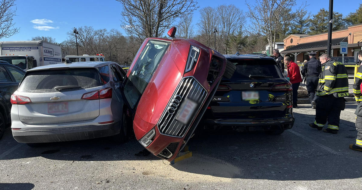 Featured image for "Wellesley Parking Lot Crash Leaves Car Wedged Between SUVs, One Injured"