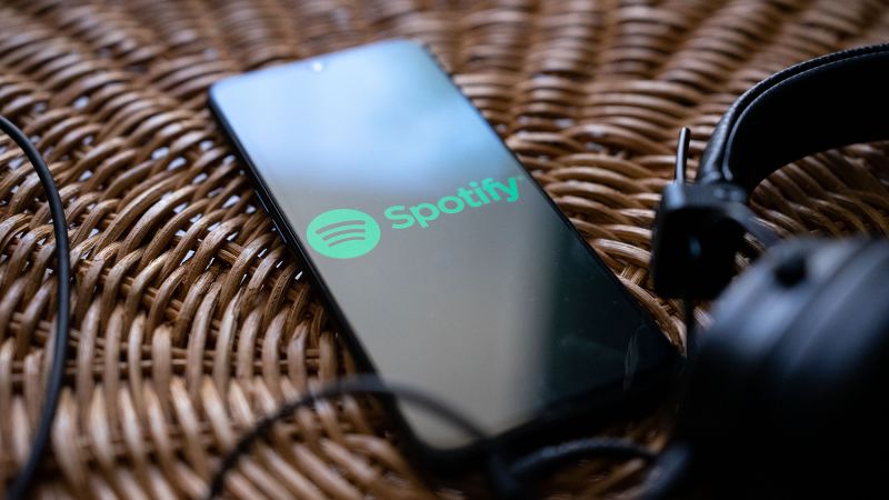 "Spotify's AI-driven strategy wins Wall Street's approval amidst CFO departure and mass layoffs"