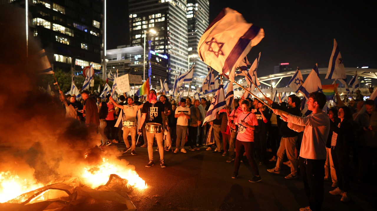 Israeli Government Forced to Delay Judicial Overhaul Amidst Mass Protests and Political Pressure.