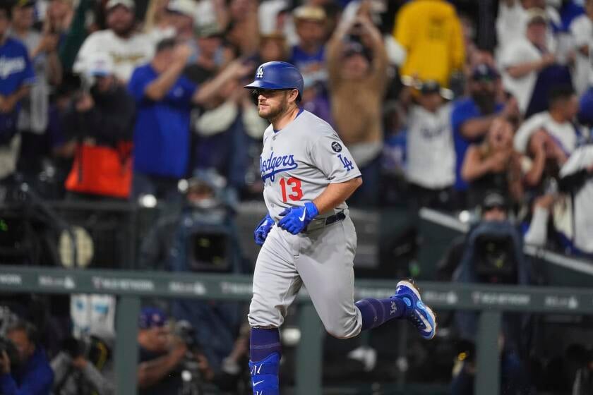 Featured image for Muncy's Rain-Driven Grand Slam Powers Dodgers Past Rockies