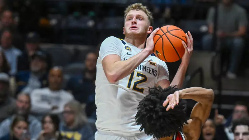 Featured image for West Virginia Triumphs 79-45 Amid DeVries' Indefinite Absence