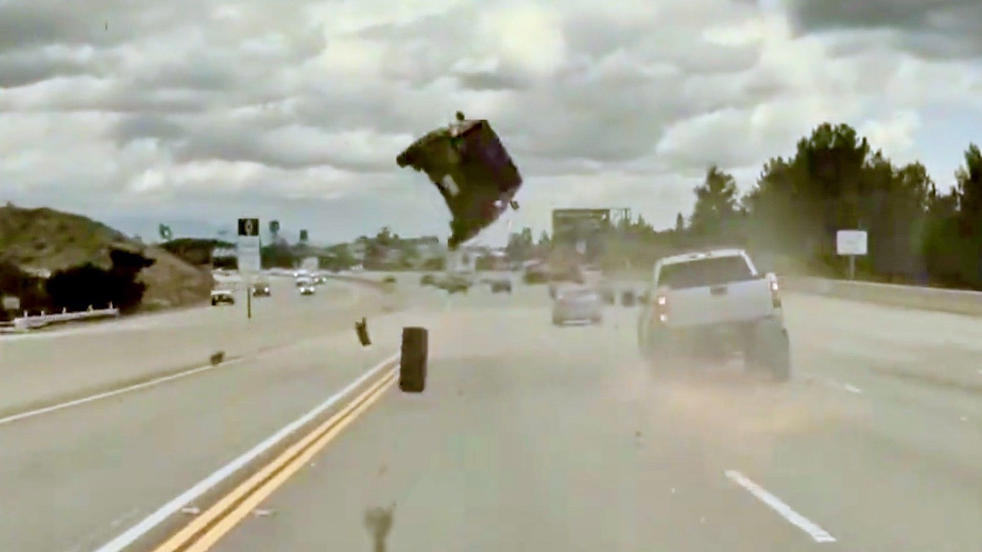 Featured image for Runaway Tire Launches Car into Orbit in Shocking Highway Crash Caught on Camera
