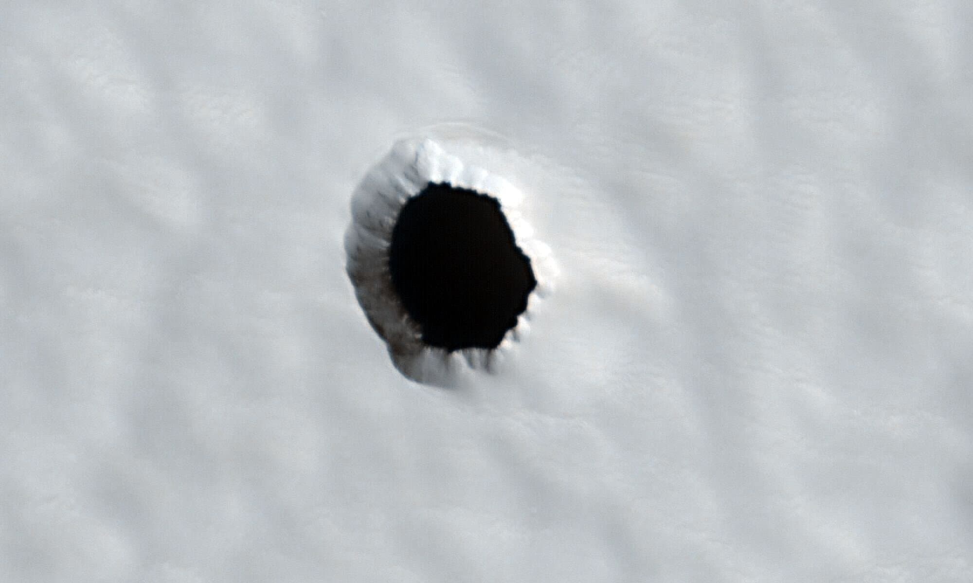 Featured image for Mysterious Martian Hole May Be Vital for Future Astronaut Survival