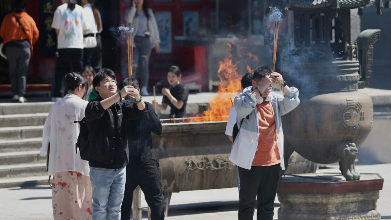 Divine Intervention Sought by Worried Chinese Amid Economic Concerns