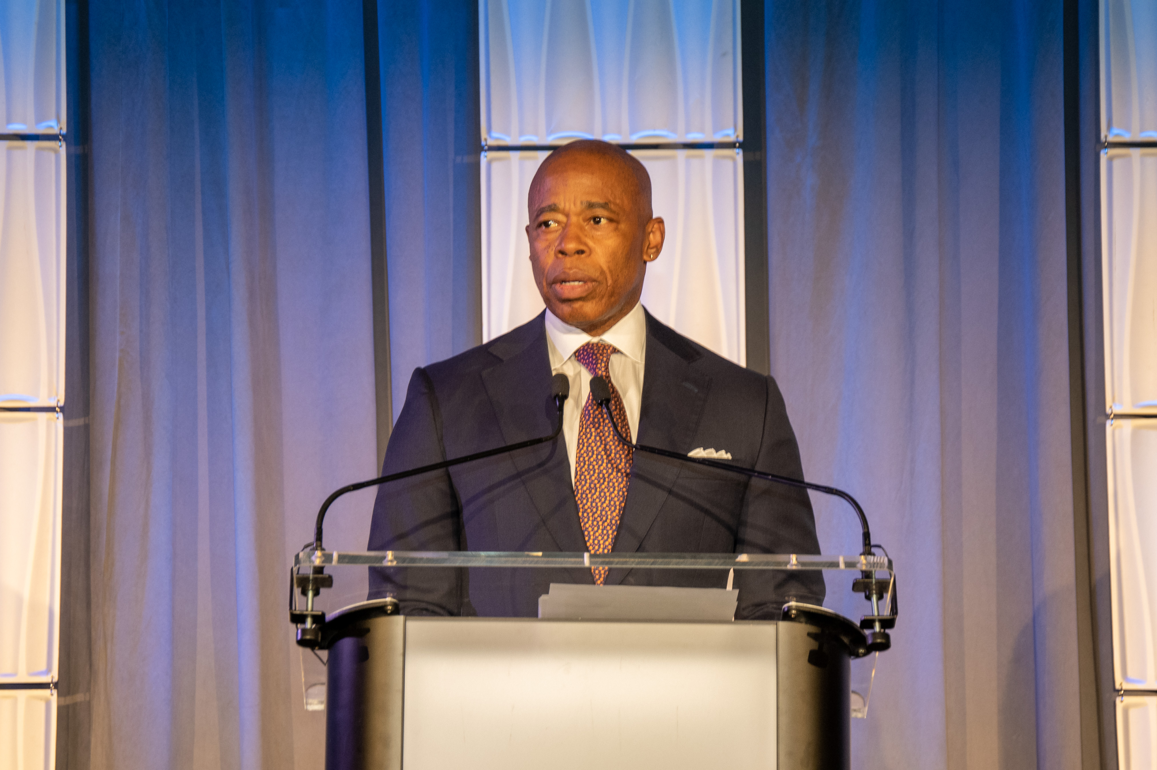 Featured image for NYC and Adams sue multiple NY counties over migrant bans.