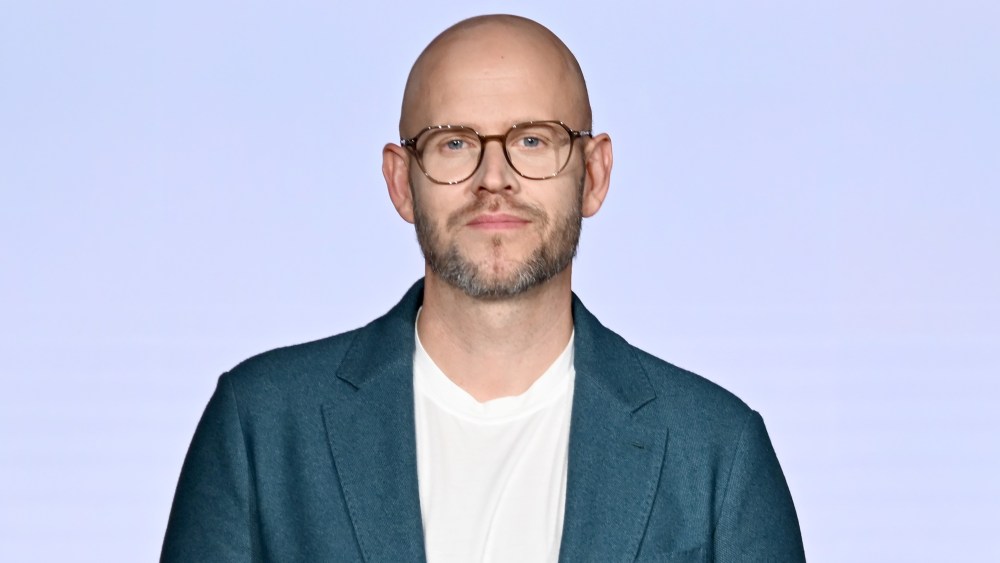 "Spotify's Record Growth and Narrowed Losses Amid Layoffs and Price Hikes"
