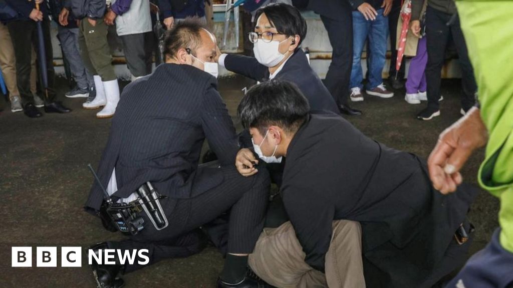 Smoke bomb thrown at Japan PM Fumio Kishida during evacuation.