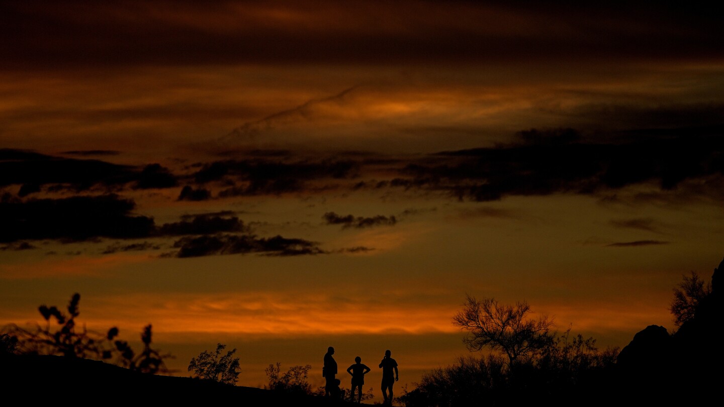 "Record-Breaking Heatwave Engulfs Phoenix and Fuels California Wildfires"