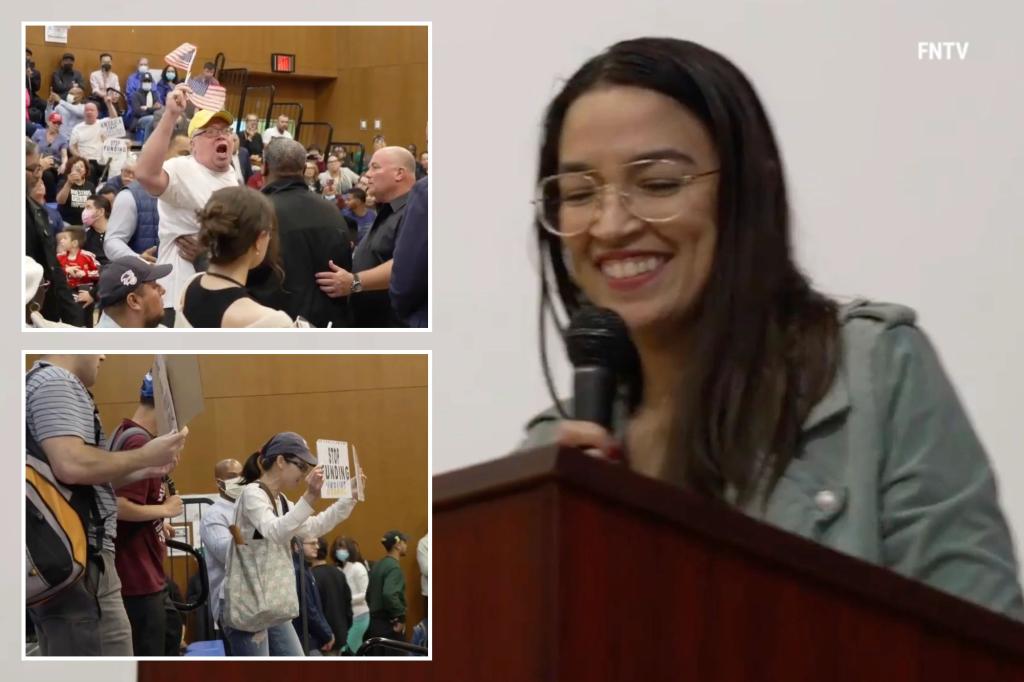 AOC faces verbal attack at NYC town hall.