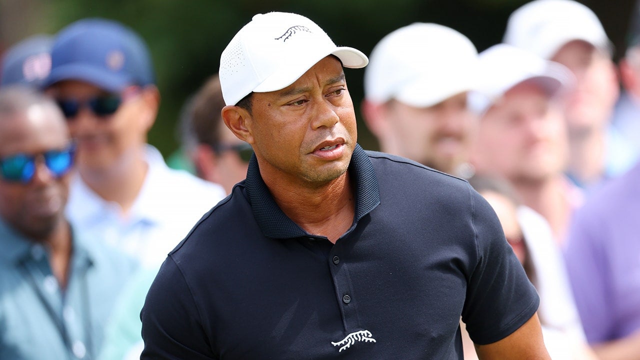 Featured image for "Masters 2024: Tiger Woods' Tee Time Delayed by Weather, Bryson DeChambeau Leads Round 1"