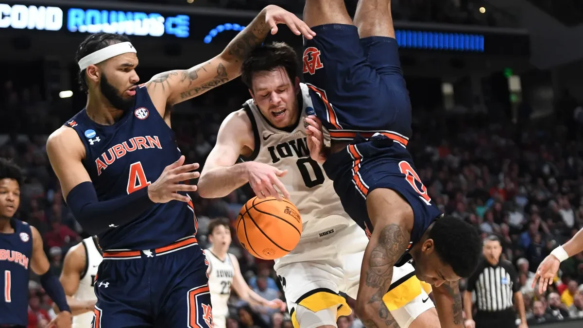 Auburn defeats Iowa in NCAA Tournament first-round matchup.
