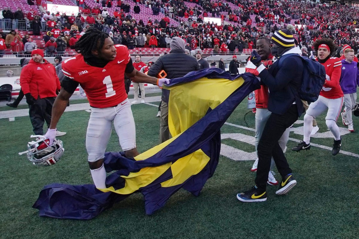 Featured image for Ohio State-Michigan Rivalry Boils Over with Postgame Brawl and Flag Controversy