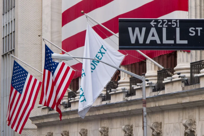 Wall Street Dips as Powell Signals Cautious Approach to Rate Cuts