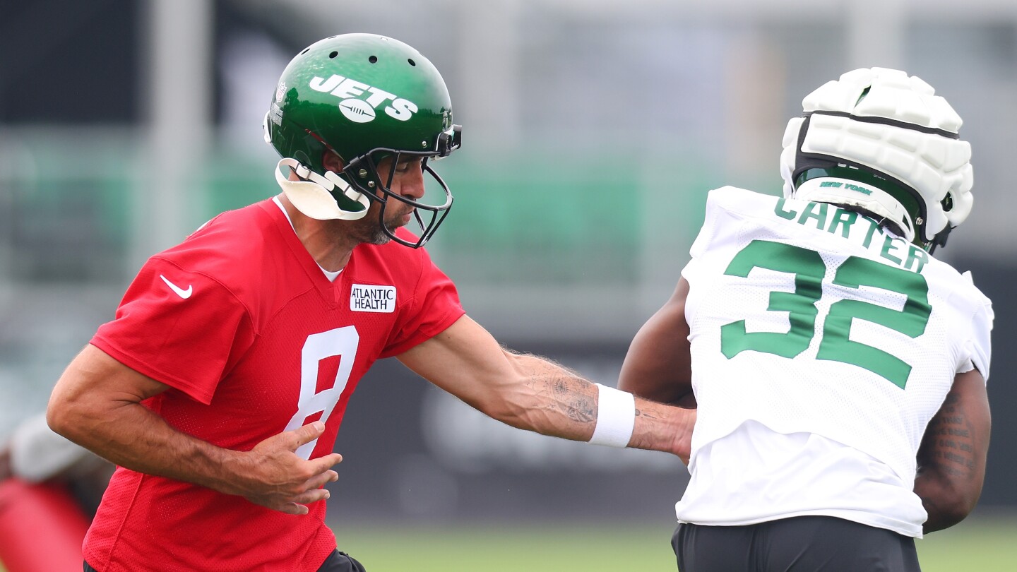 Aaron Rodgers brings a patient and competitive edge to the NY Jets training camp
