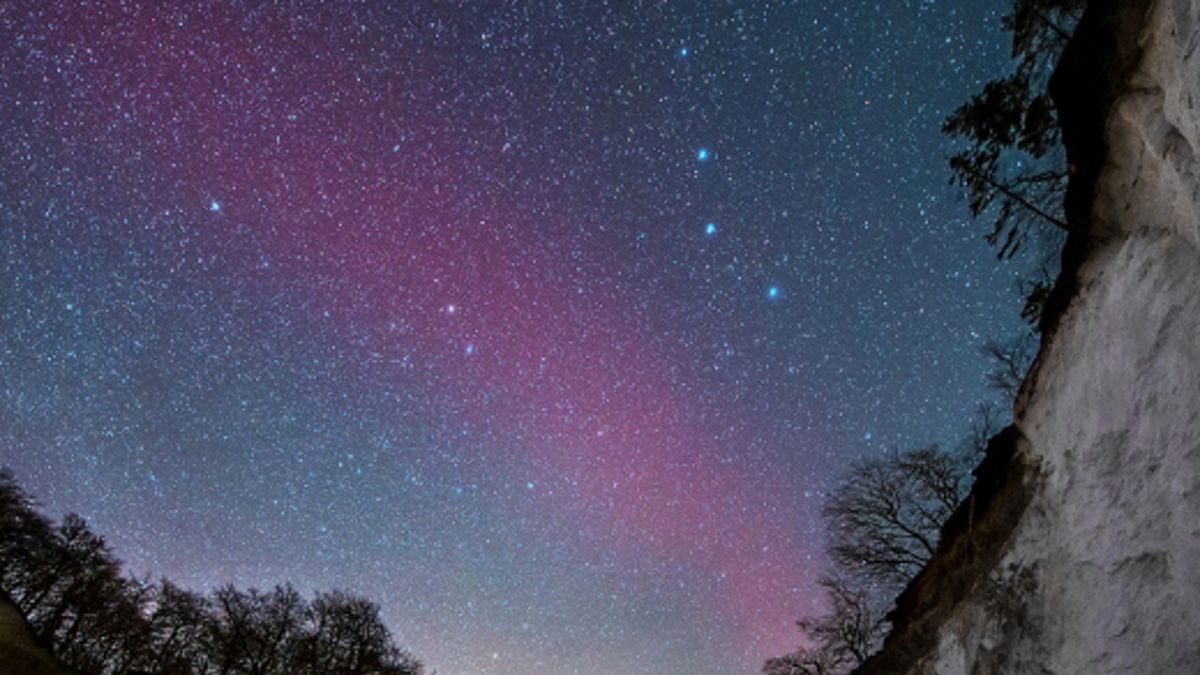 Mysterious Blood-Red Arc Appears in Scandinavian Sky.