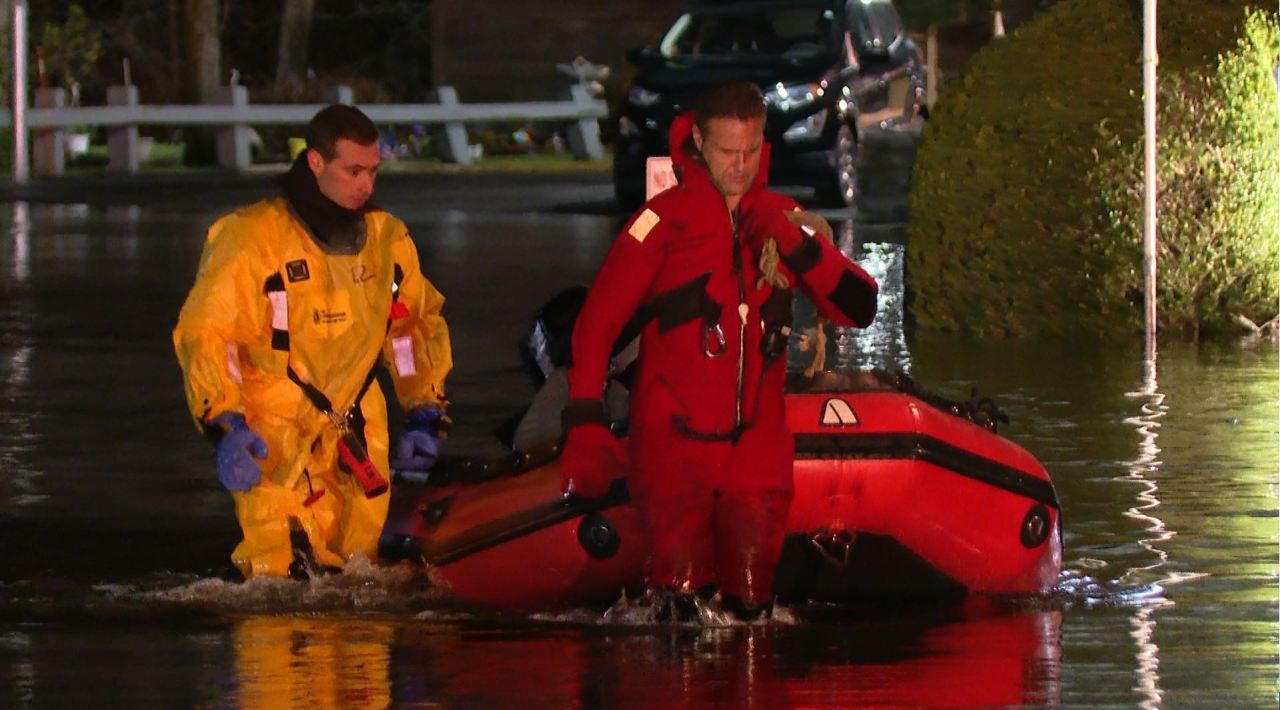 Featured image for Flooded Cranston: Residents rescued, rivers rise