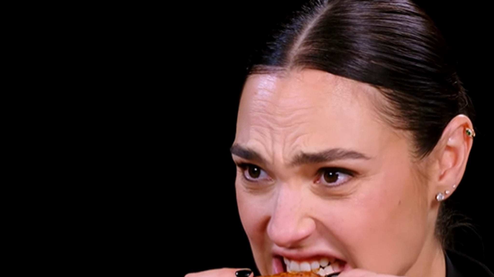 Gal Gadot's Fiery Hot Ones Interview: Spitting, Reacting, and Losing Her Mind
