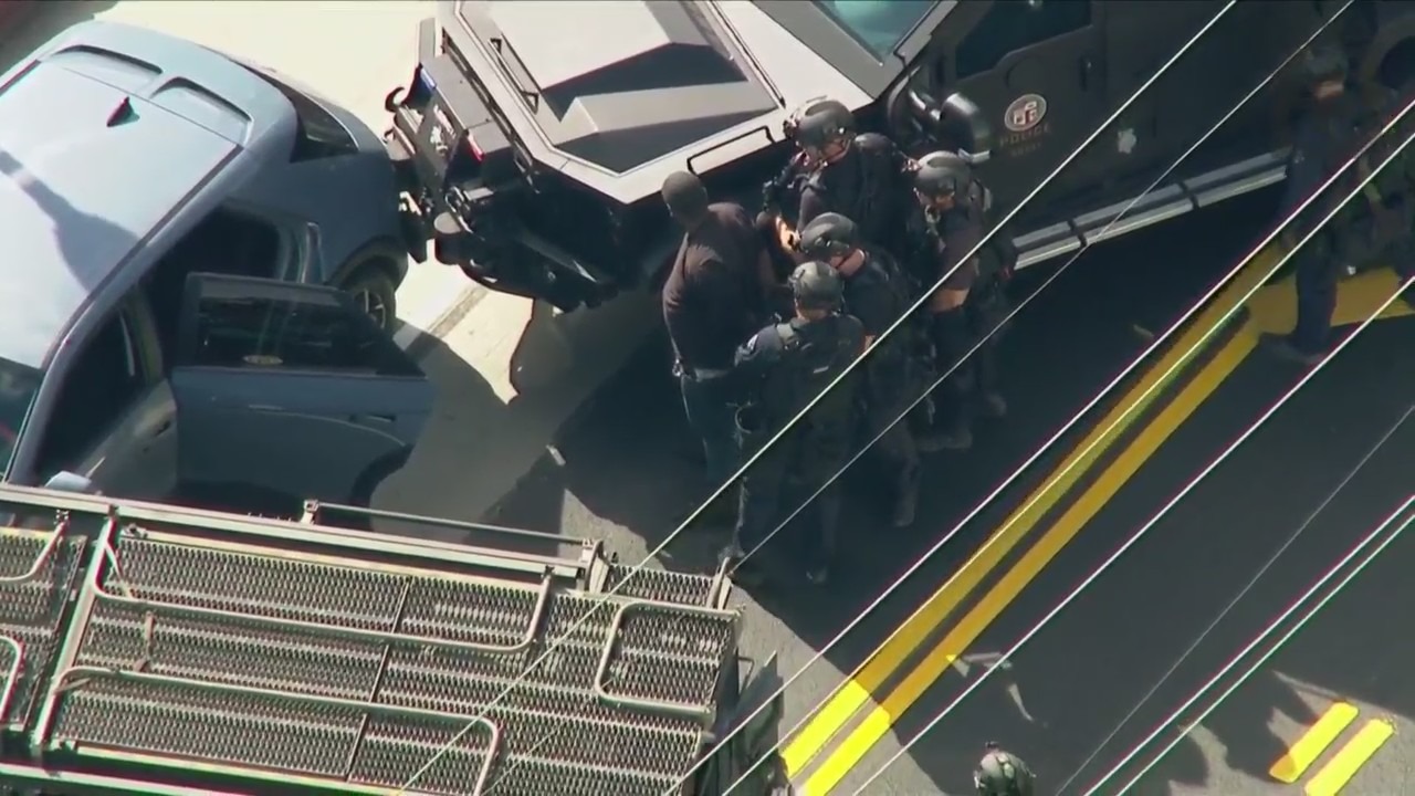 Armed Uber passenger apprehended after lengthy standoff with police