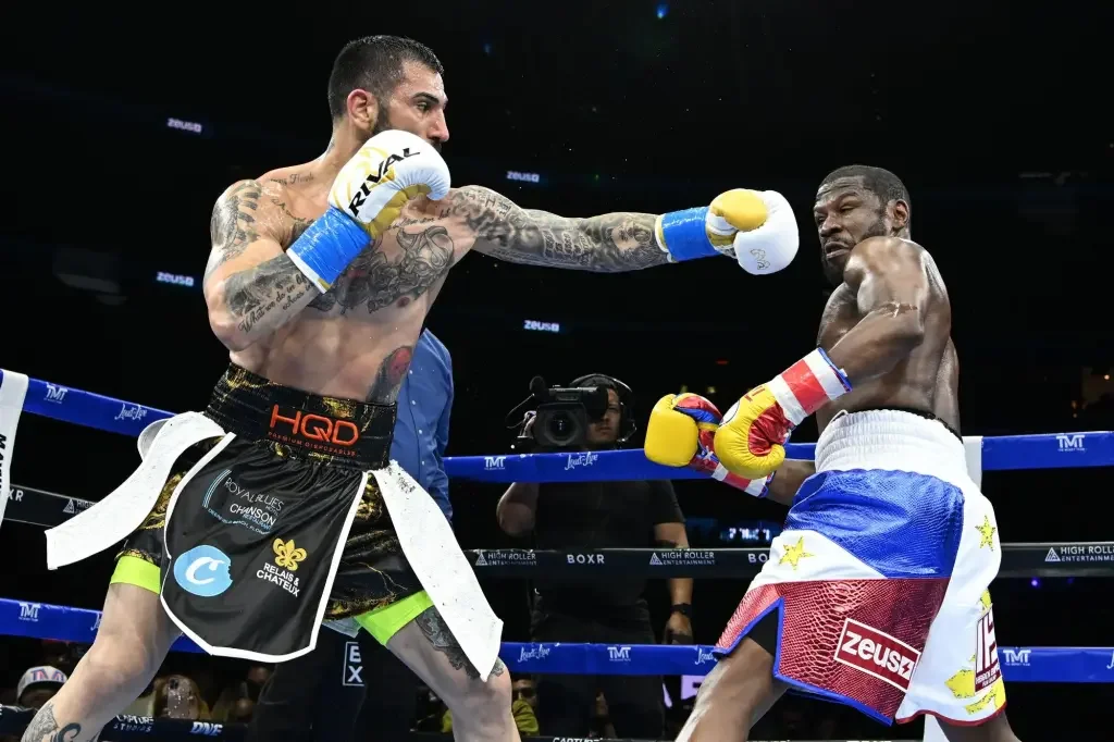 Boxer John Gotti III suspended for role in Mayweather brawl.