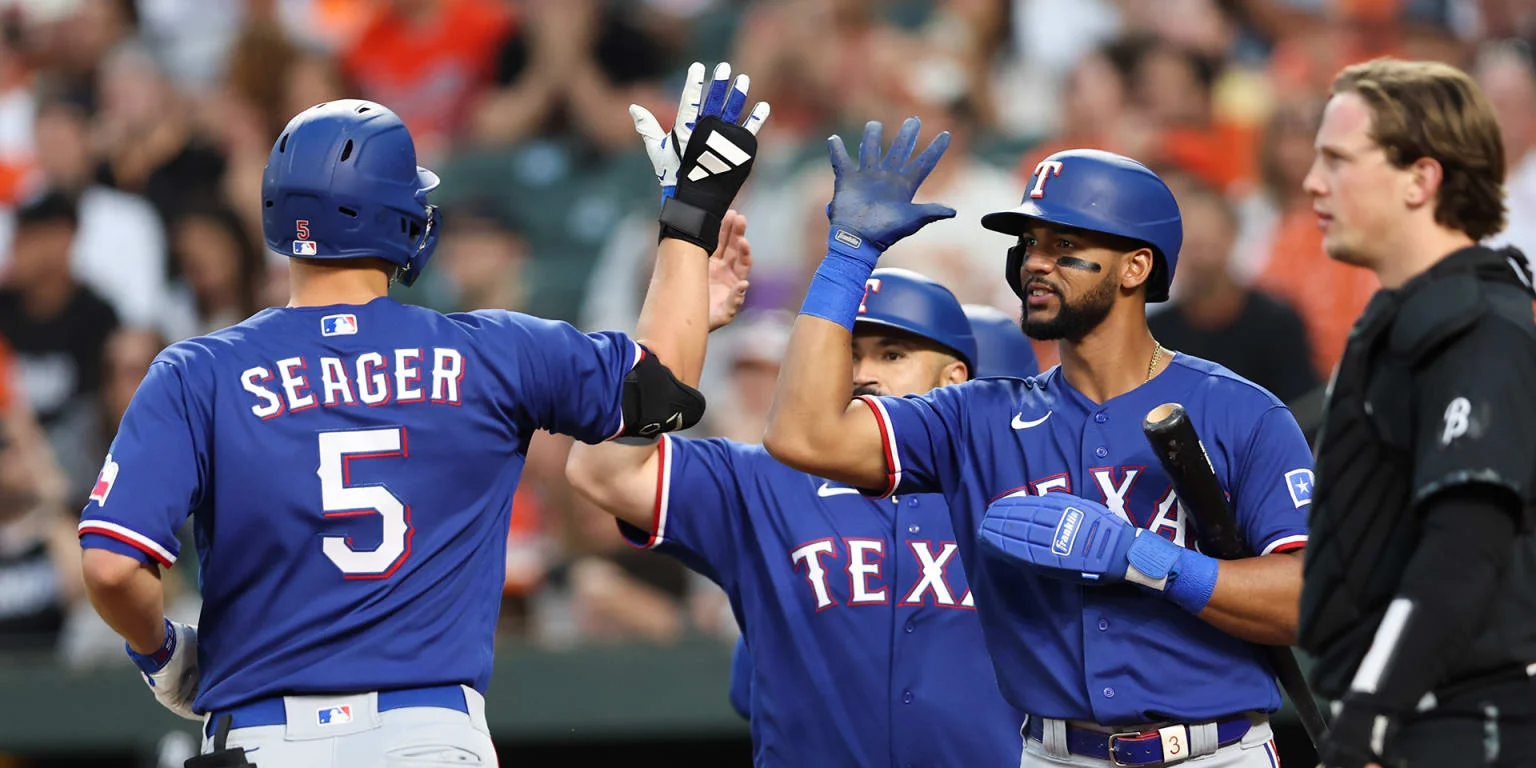 Rangers dominate Orioles with 12-2 blowout win.