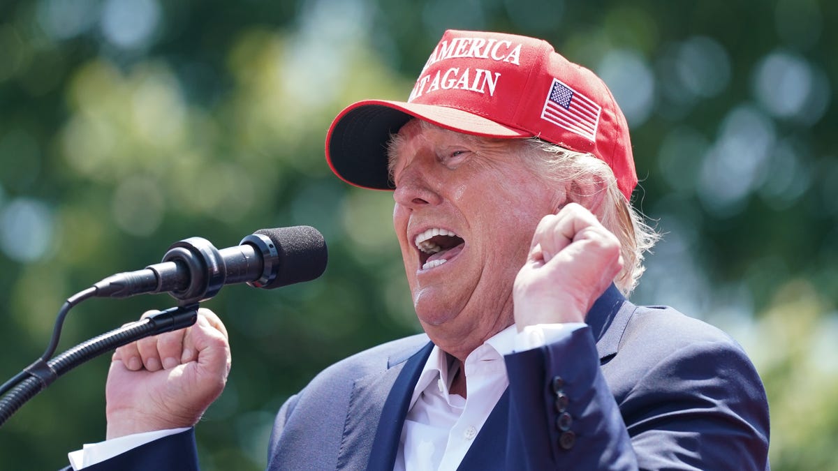 "Trump's Iowa Town Hall: Legal Challenges, Indictment Predictions, and Loyal Supporters"