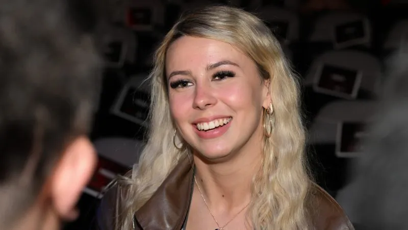 Featured image for Crypto Controversy: 'Hawk Tuah' Girl's Memecoin Faces Backlash