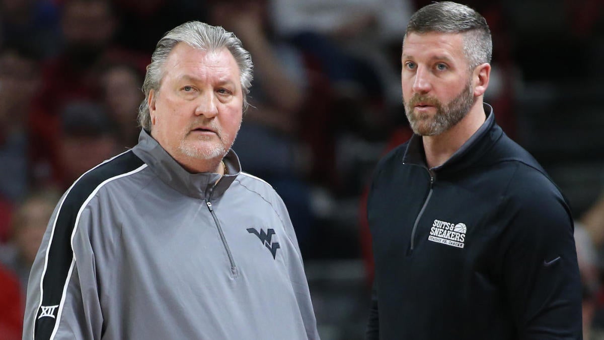 Josh Eilert named interim head coach for West Virginia men's basketball team.