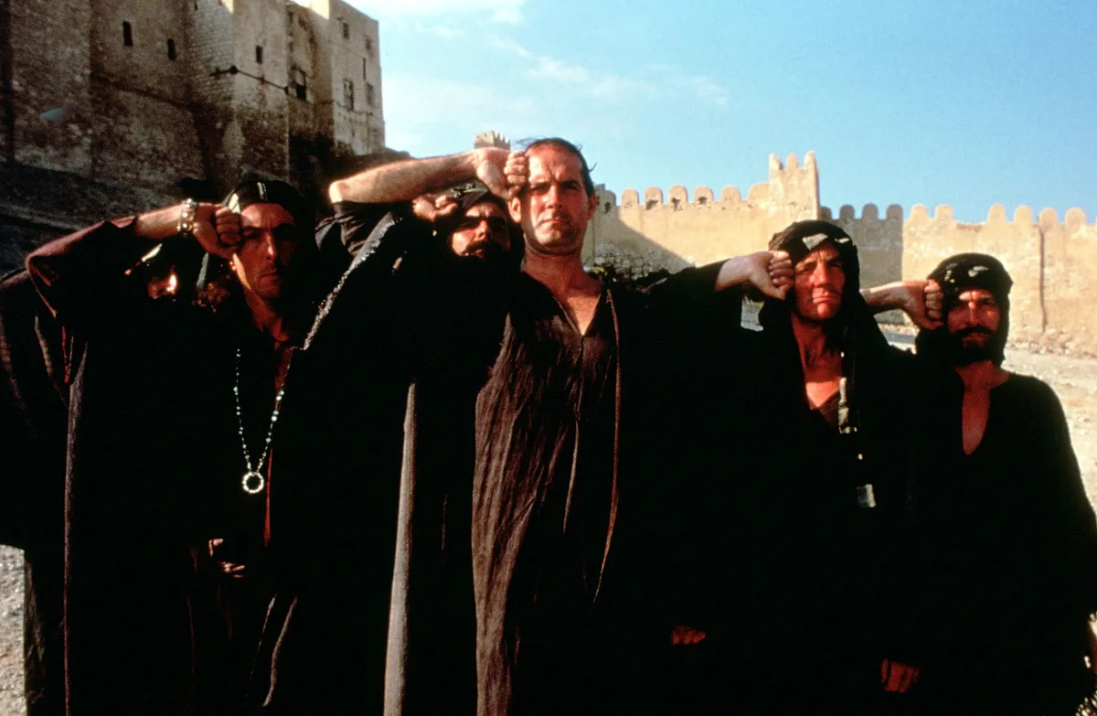 Featured image for John Cleese Stands Firm on Keeping Controversial Scene in 'Life of Brian' Stage Show.