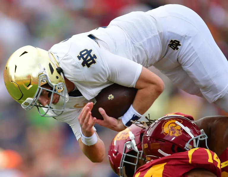 Featured image for Notre Dame Secures Playoff Spot with Resilient Win Over USC