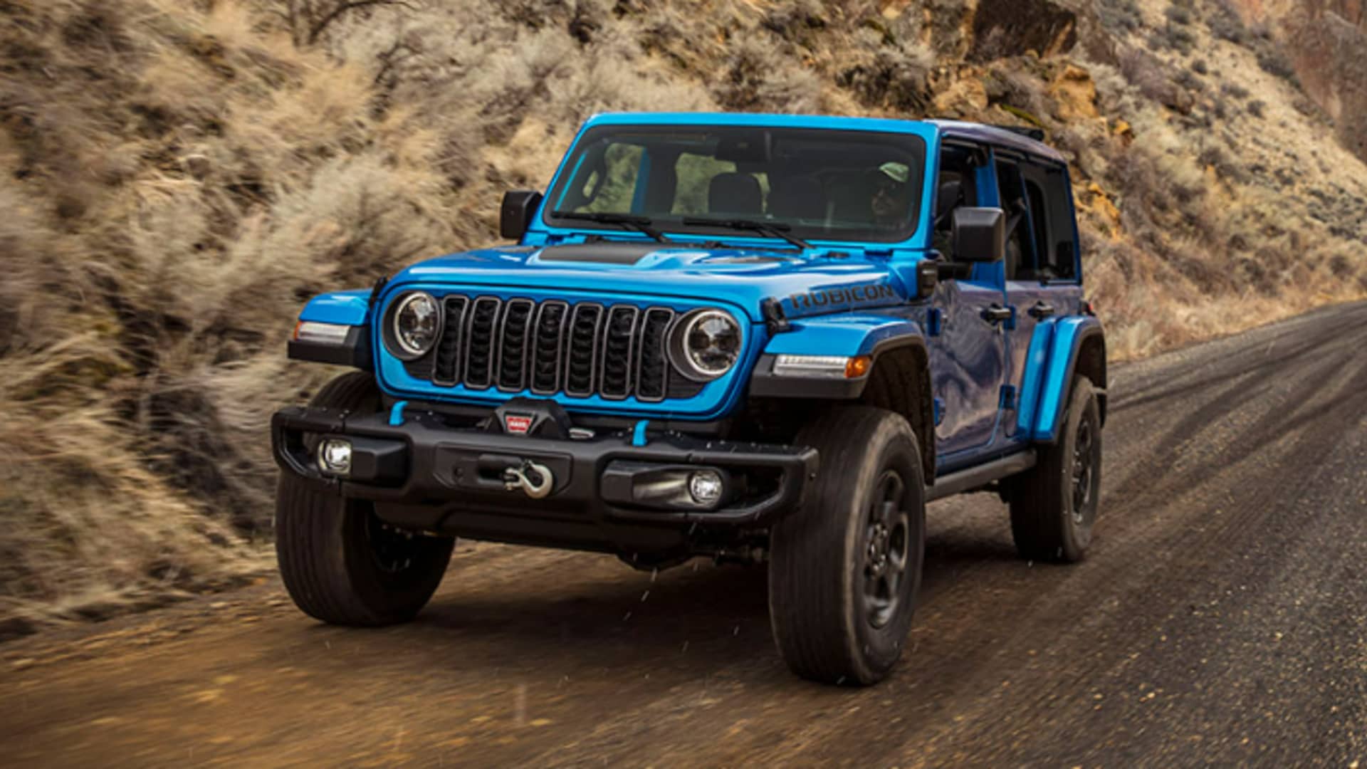 Featured image for Jeep's 2024 Wrangler: Plug-in hybrids, new infotainment, and controversial grille.