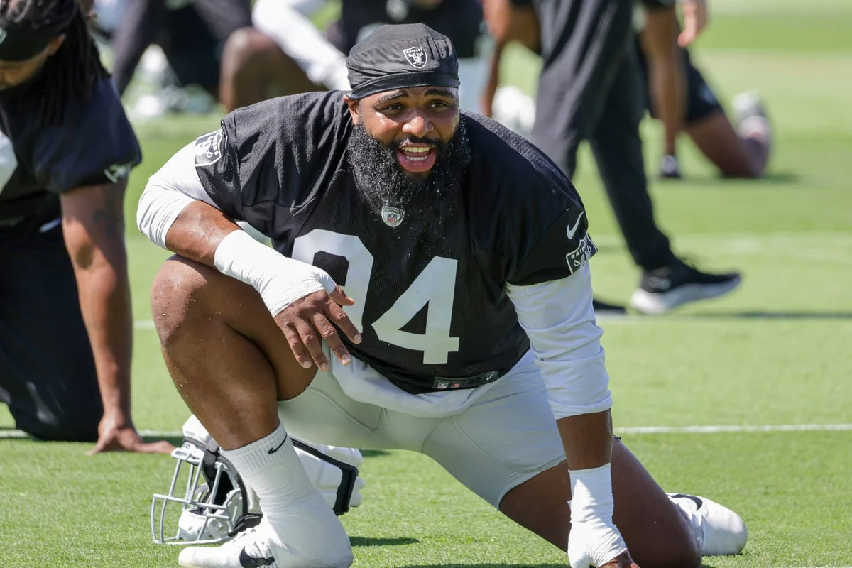 Raiders Release Christian Wilkins Over Unwanted Team Kiss