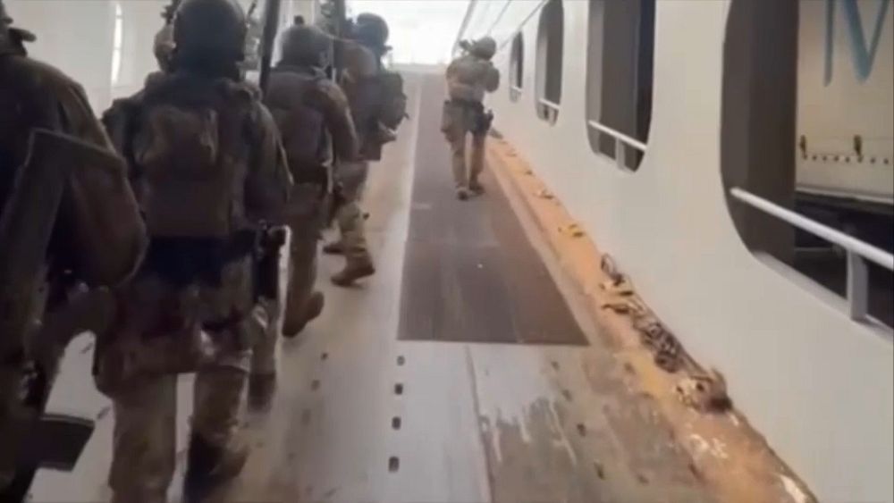 Italian forces rescue Turkish ship from armed stowaways near Naples.