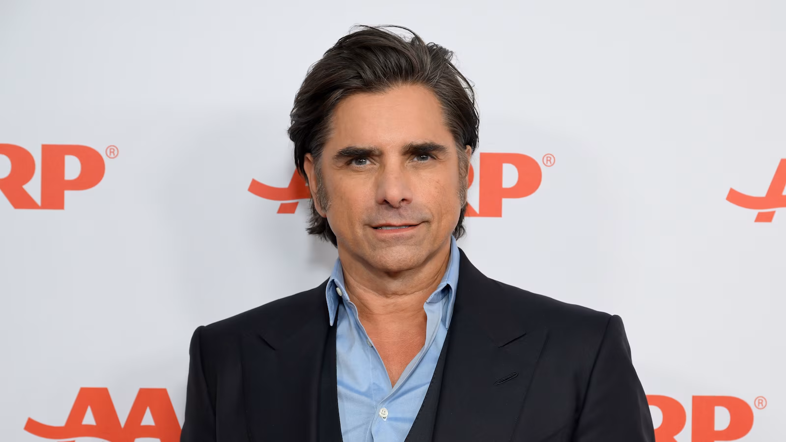 Featured image for John Stamos Criticizes Mossimo Giannulli and Defends Lori Loughlin