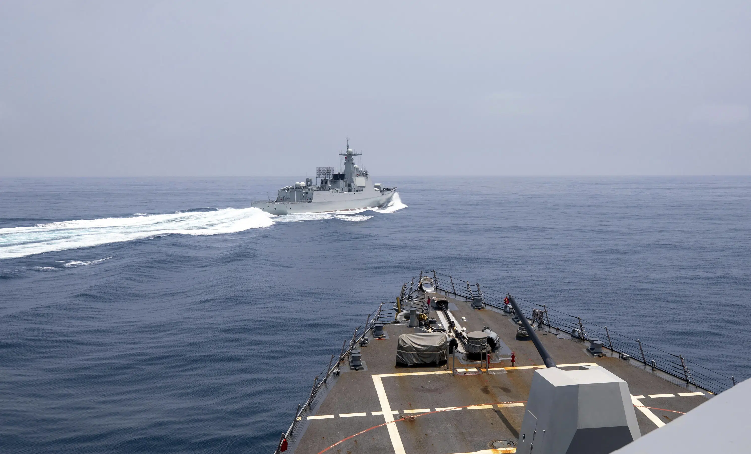 Tensions rise as US and Chinese warships narrowly avoid collision in Taiwan Strait.