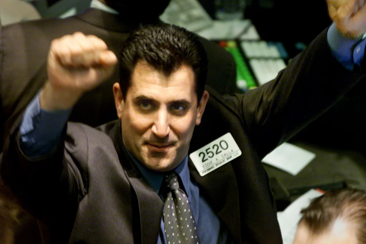 Featured image for "Stocks Soar as Fed Signals Rate Cuts, Dow Hits Record High"