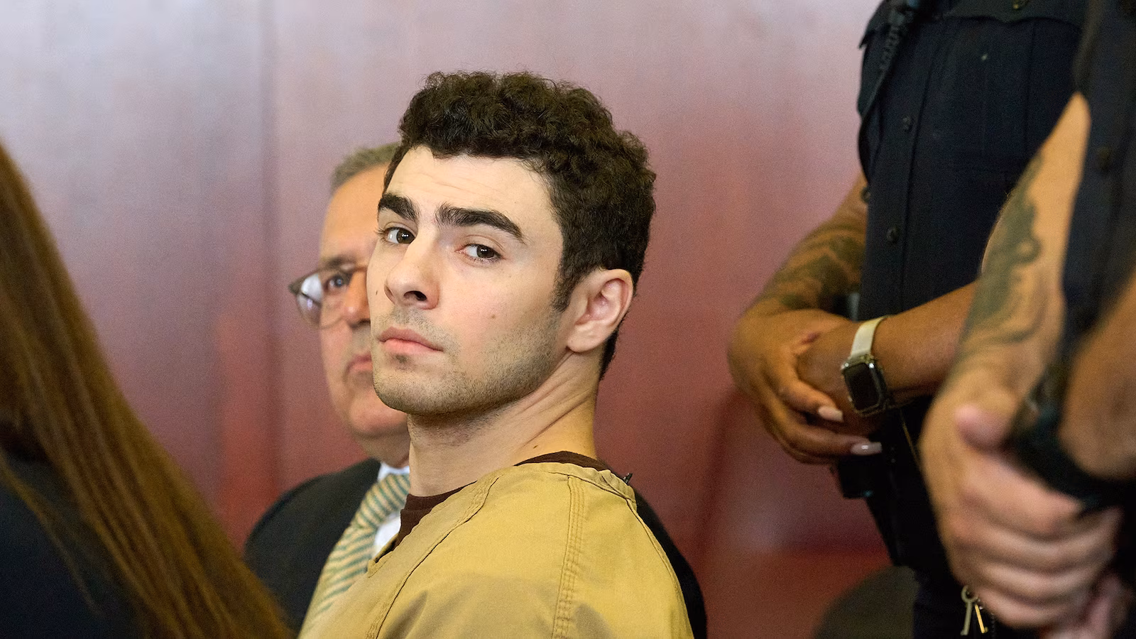 Featured image for Mangione's Lawyers Claim He's Being Used as a Political Pawn in Trump-Related Charges