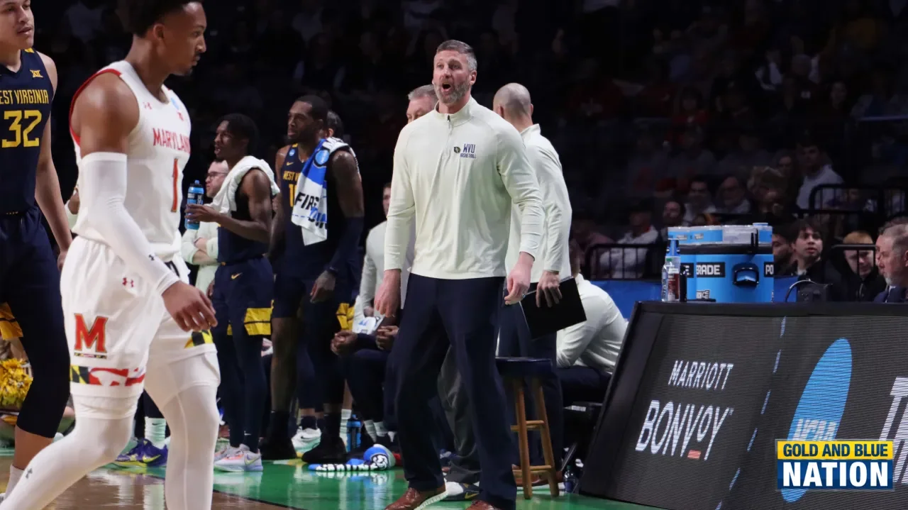 Josh Eilert appointed interim head coach for WVU men's basketball team.