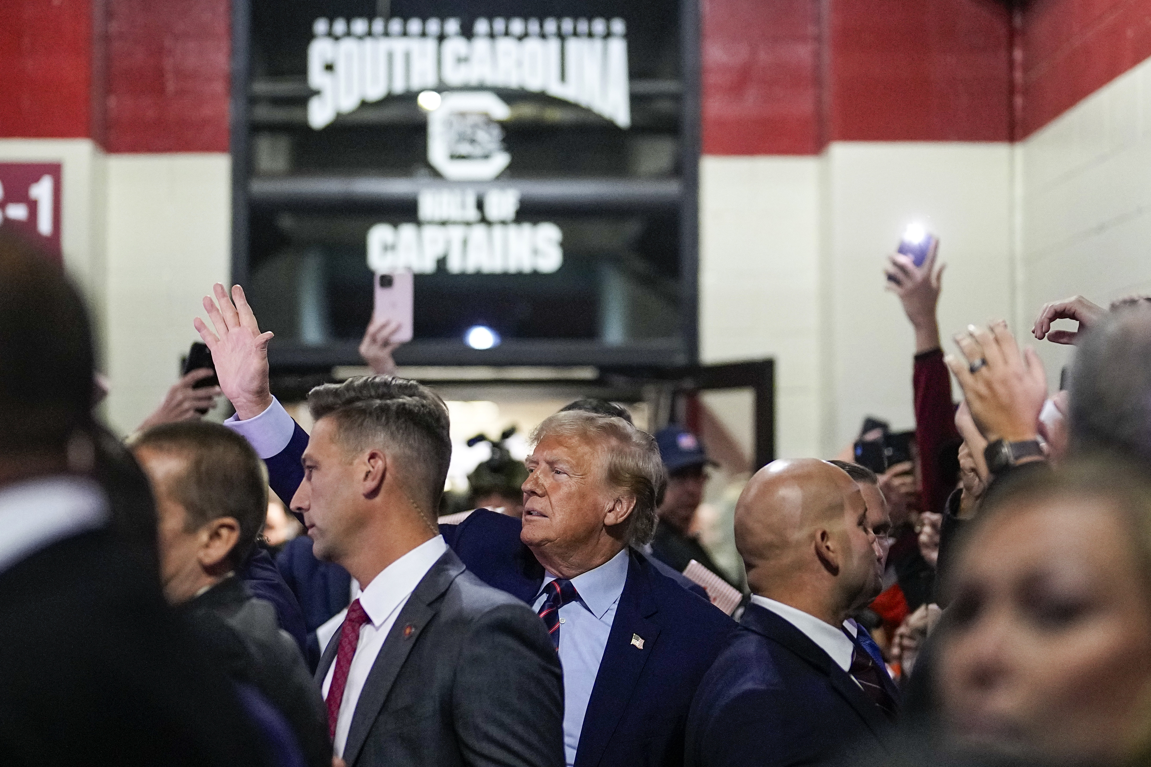 Trump's Visit to South Carolina Football Game Met with Cheers and Taunting Billboards