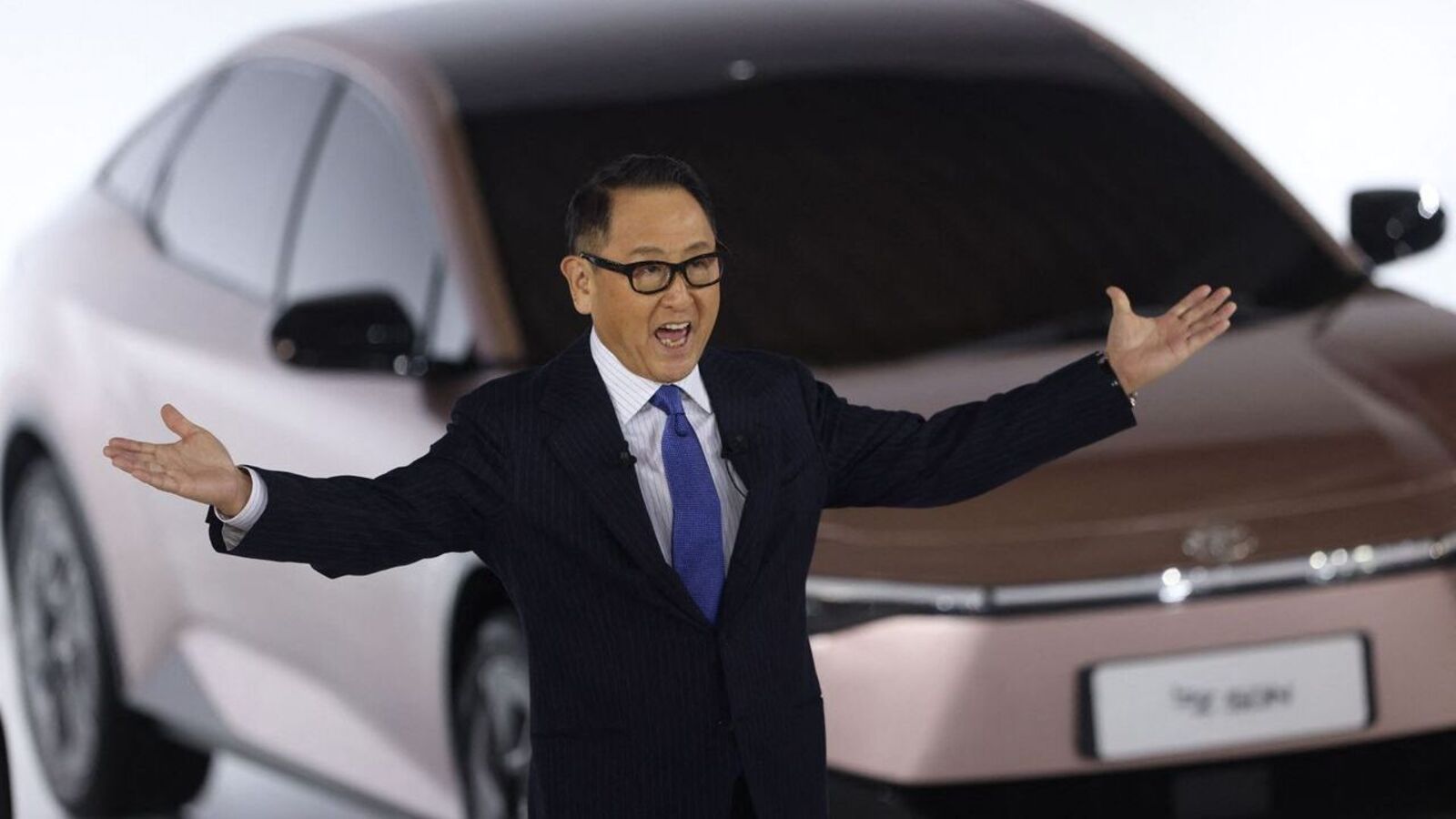 "Electric Shock: Tesla Takes on Toyota in the Battle for Car Supremacy"