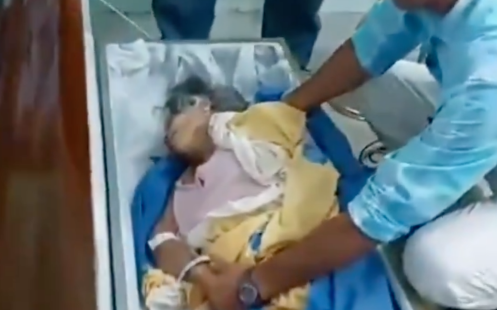 Ecuadoran woman declared dead shocks family by appearing at her own funeral.