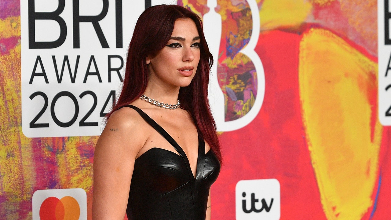 Featured image for "Dua Lipa Shines in Leather at 2024 BRIT Awards Red Carpet"