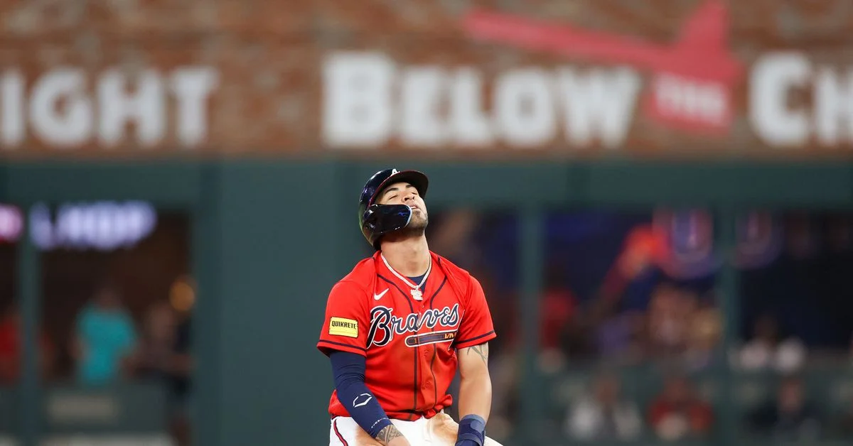 "Phillies sink Braves with walks and homers in 6-4 victory"