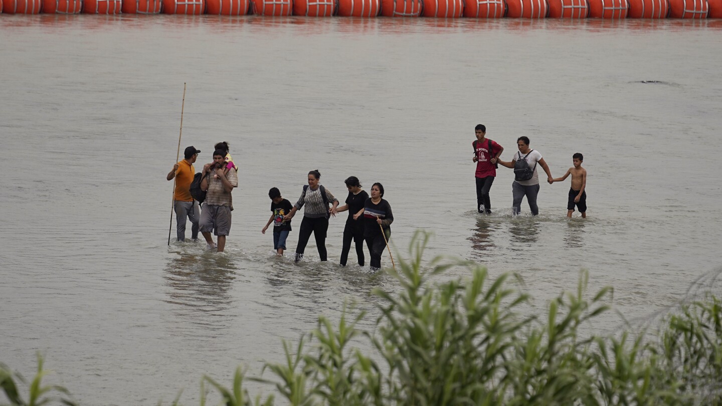 Texas Governor and Biden Head to Court in Showdown over Floating Border Barrier