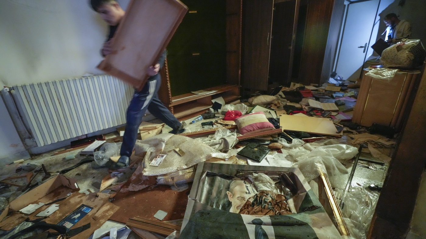 Syrians Loot Assad's Palaces, Uncover Luxury Car Collection