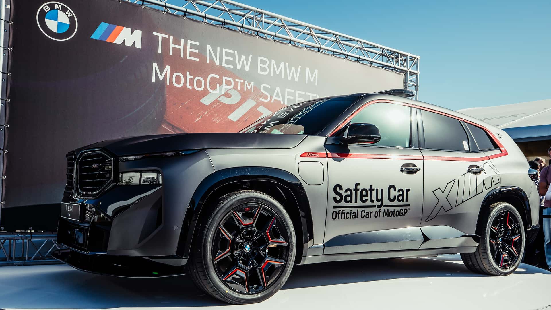 Francesco Bagnaia Triumphs in BMW's Powerful XM Label Red Safety Car