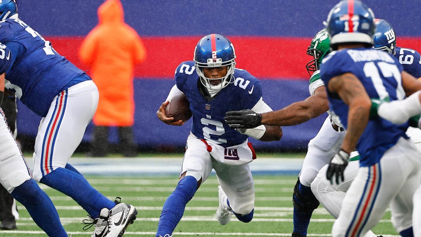"Tyrod Taylor's Return to Giants Sparks Quarterback Debate"