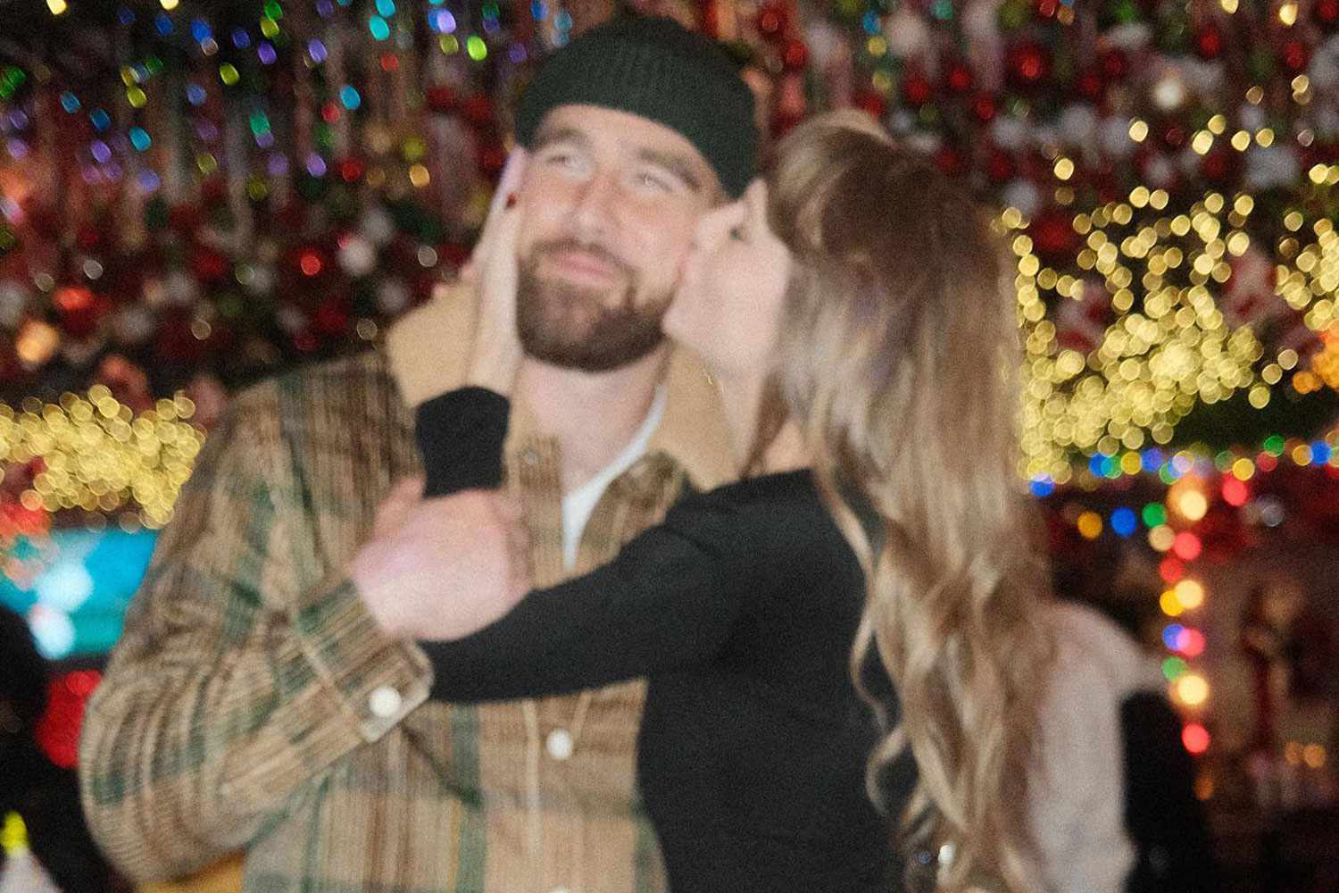 "Taylor Swift's Sweet Kiss with Travis Kelce Sparks Fan Frenzy"